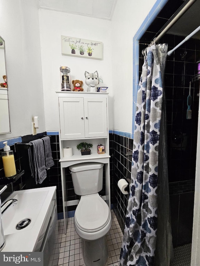 bathroom featuring a shower with curtain, tile walls, tile patterned flooring, and toilet