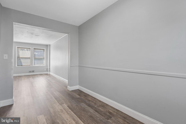 spare room featuring hardwood / wood-style floors