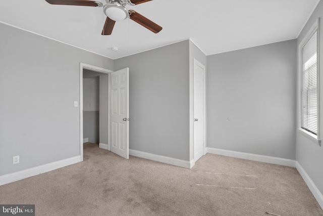 unfurnished bedroom featuring ceiling fan and light colored carpet