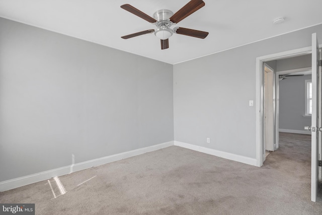 carpeted empty room with ceiling fan