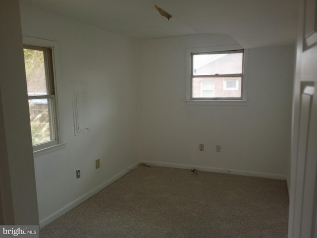 carpeted spare room with plenty of natural light