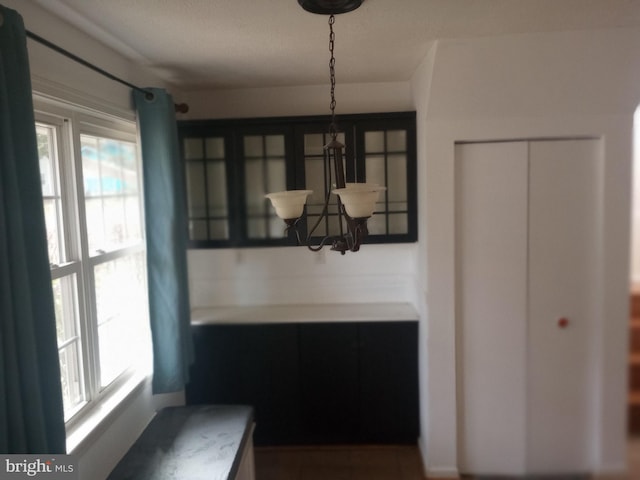 dining area featuring a notable chandelier