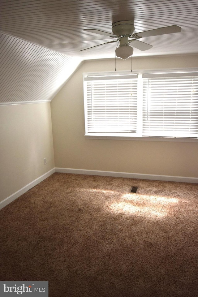 additional living space featuring lofted ceiling, ceiling fan, and carpet floors