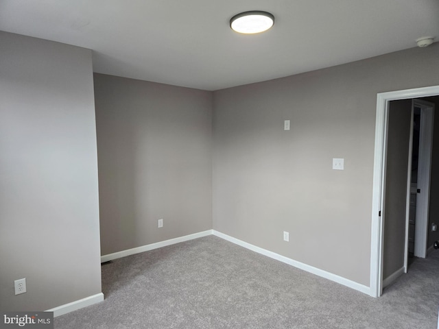 empty room with light colored carpet