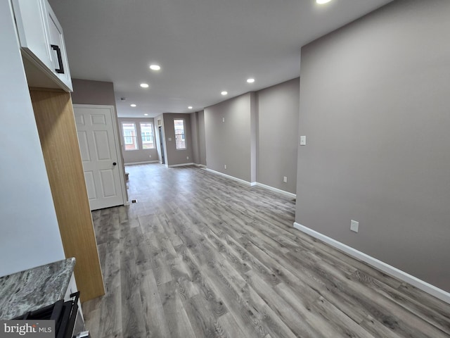 unfurnished living room with light wood-type flooring