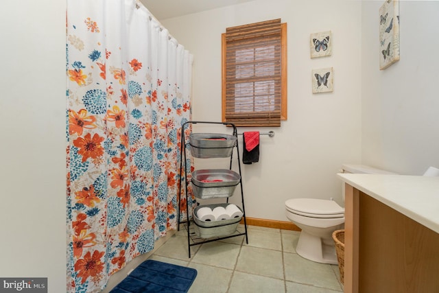 bathroom with tile patterned flooring, vanity, toilet, and a shower with shower curtain