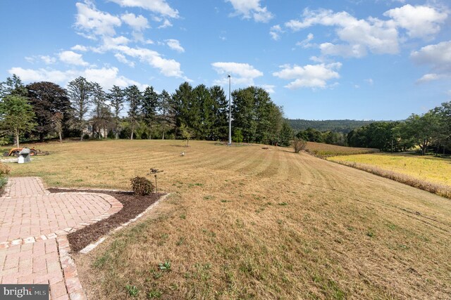 birds eye view of property featuring a rural view