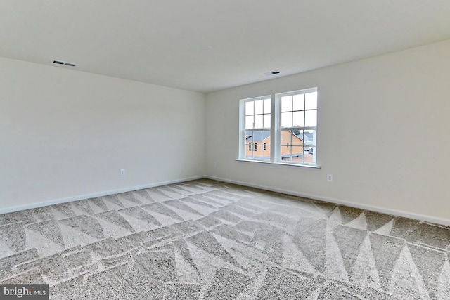 spare room with light carpet