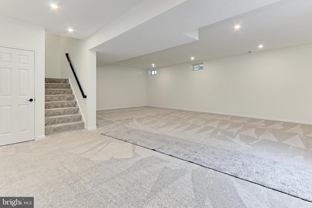 basement with light colored carpet