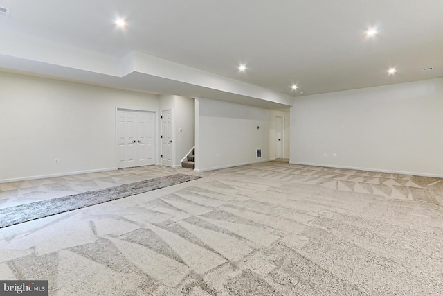 basement with light colored carpet