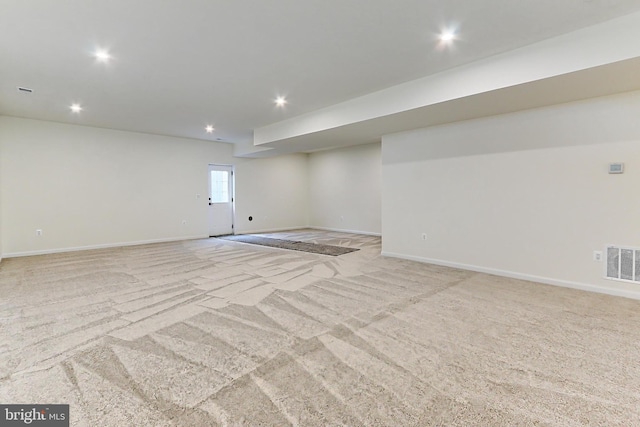 unfurnished room with light carpet