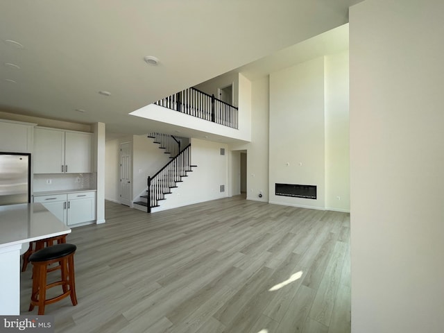 unfurnished living room with light wood-type flooring