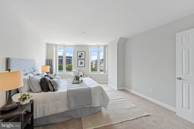 bedroom with light colored carpet