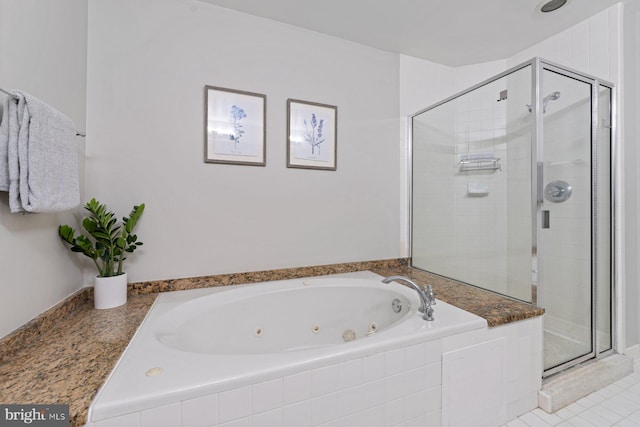 bathroom with plus walk in shower and tile patterned flooring