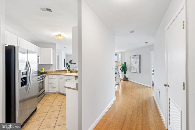 interior space featuring light hardwood / wood-style flooring and sink