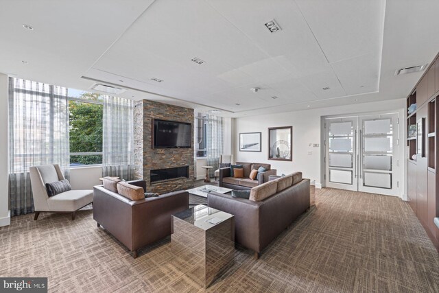 carpeted living room with a fireplace