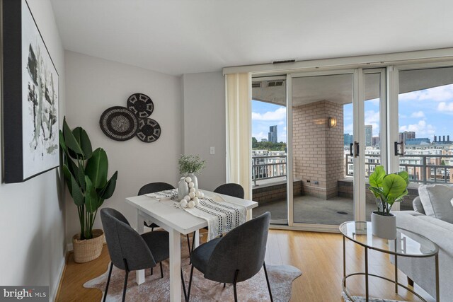 dining space featuring light wood-type flooring