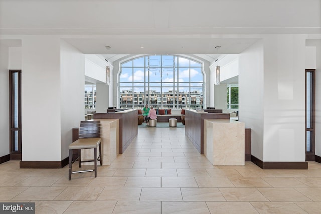 kitchen with decorative light fixtures and light tile patterned flooring