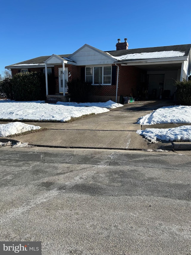 view of front of property with a carport