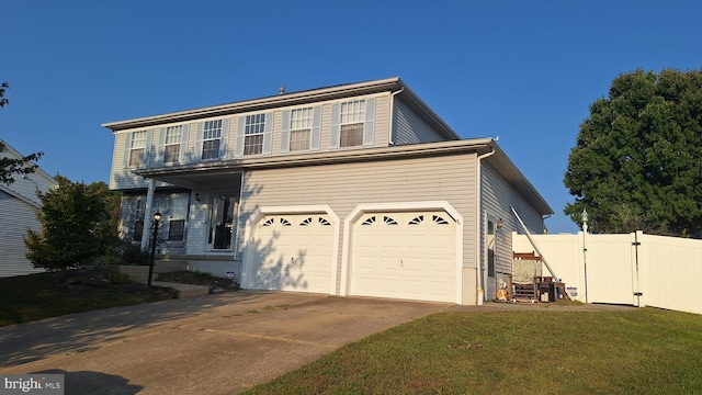 view of front property with a front yard and a garage