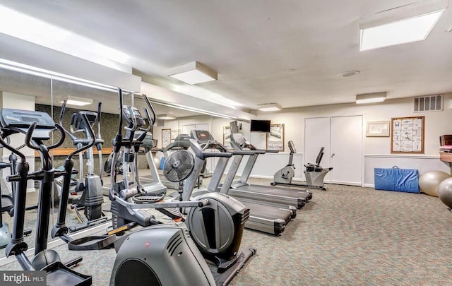 exercise room featuring carpet