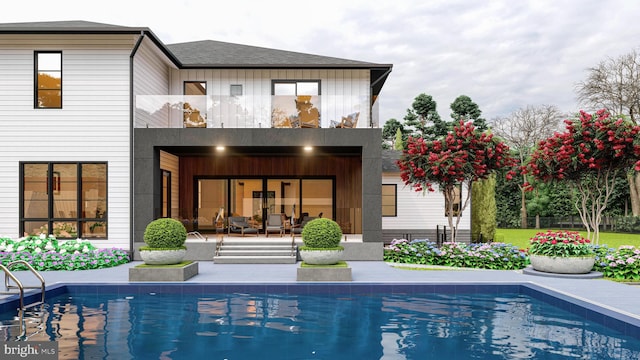 back of property featuring an outdoor pool, a balcony, and a patio