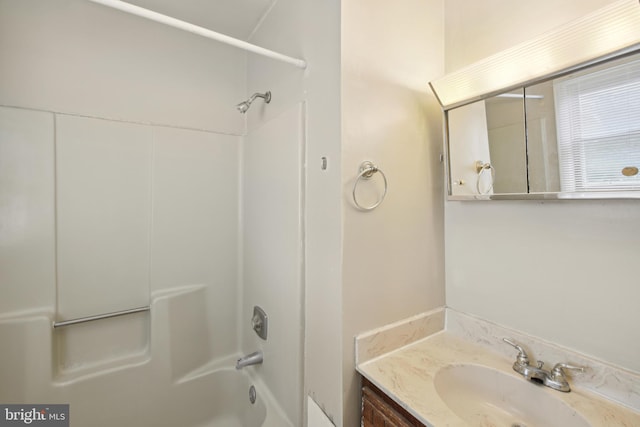 bathroom with washtub / shower combination and vanity