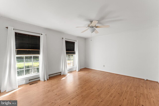 unfurnished room with ceiling fan, a baseboard radiator, light hardwood / wood-style floors, and crown molding