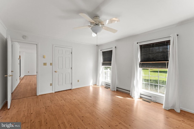 unfurnished bedroom with light wood-type flooring, ceiling fan, a baseboard radiator, and ornamental molding