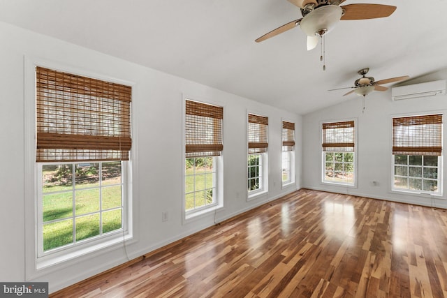 empty room with lofted ceiling, plenty of natural light, and ceiling fan