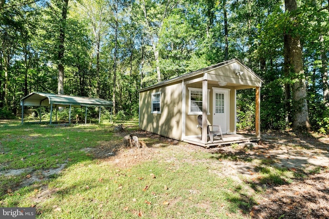 view of outdoor structure featuring a lawn and a carport