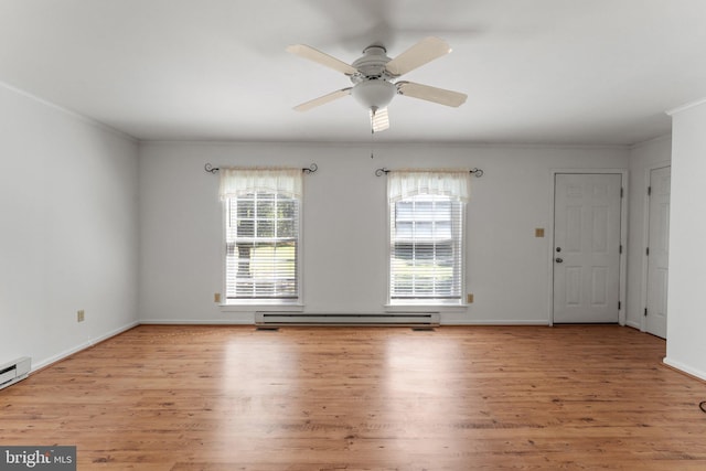 interior space featuring ceiling fan, a baseboard radiator, ornamental molding, and light hardwood / wood-style flooring