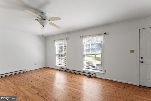 interior space featuring a baseboard heating unit, ceiling fan, crown molding, and light hardwood / wood-style flooring