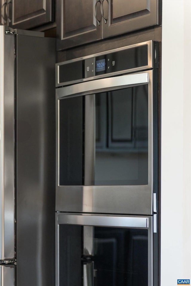 interior details featuring appliances with stainless steel finishes and dark brown cabinetry