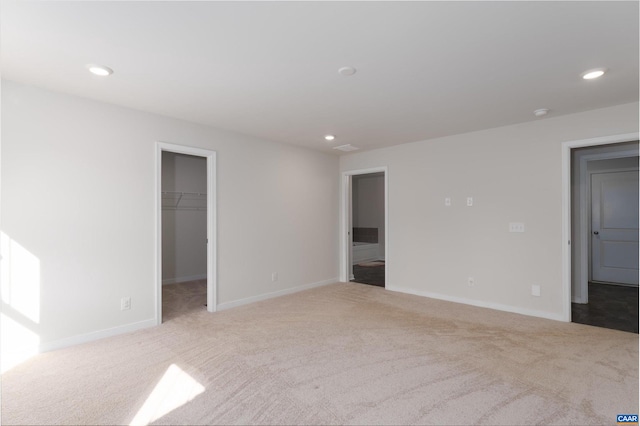 empty room featuring light colored carpet