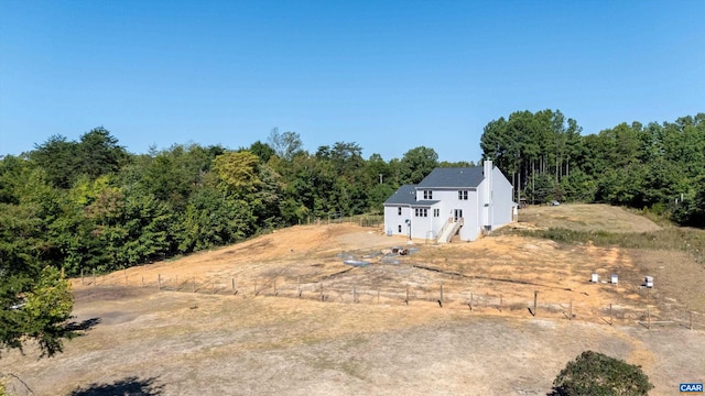 view of yard with a rural view