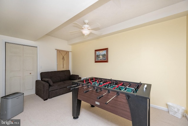 rec room featuring ceiling fan and light colored carpet