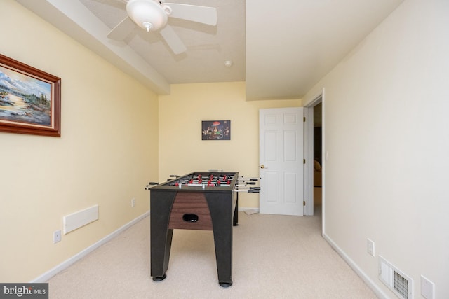 recreation room featuring ceiling fan and light colored carpet