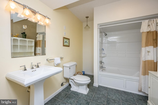 bathroom featuring shower / bath combination with curtain and toilet