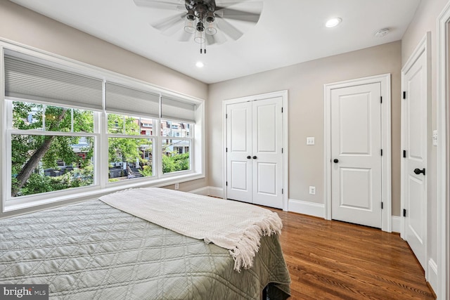 bedroom featuring ceiling fan and hardwood / wood-style flooring