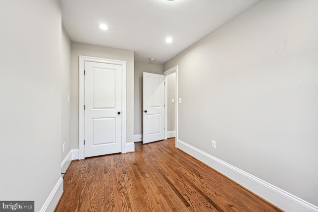 unfurnished bedroom featuring wood-type flooring