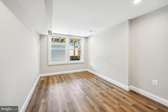 unfurnished room featuring hardwood / wood-style floors