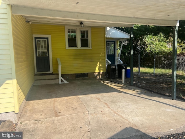 entrance to property with a carport