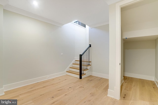 staircase with hardwood / wood-style flooring