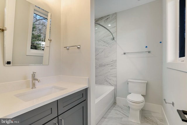 full bathroom with vanity, toilet, and tiled shower / bath