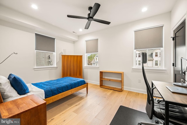 bedroom featuring ceiling fan and light hardwood / wood-style flooring