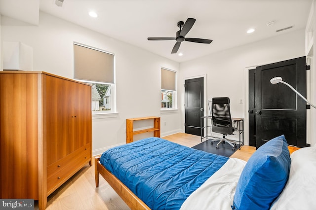 bedroom featuring ceiling fan and light wood-type flooring