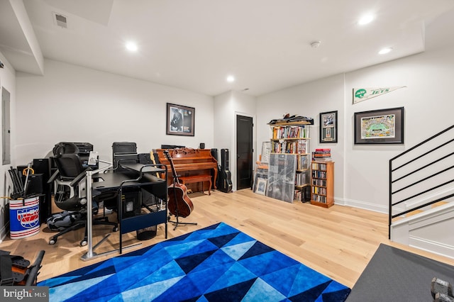 office space with wood-type flooring