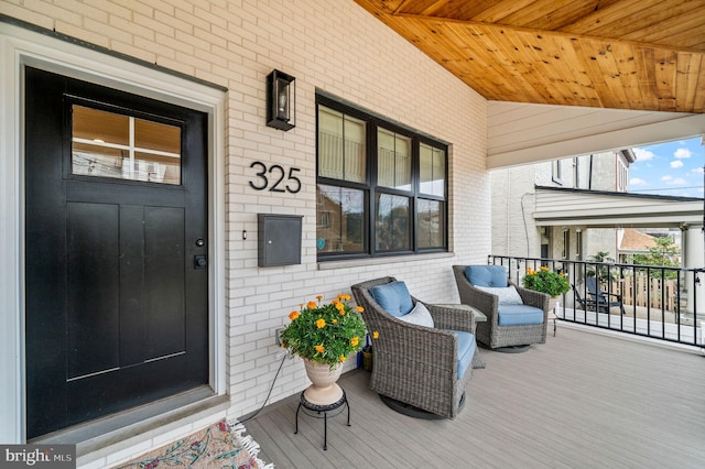 view of exterior entry featuring a porch