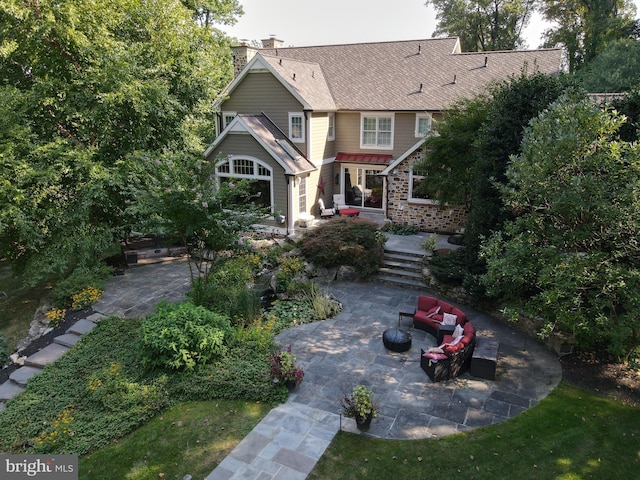 rear view of house with a patio